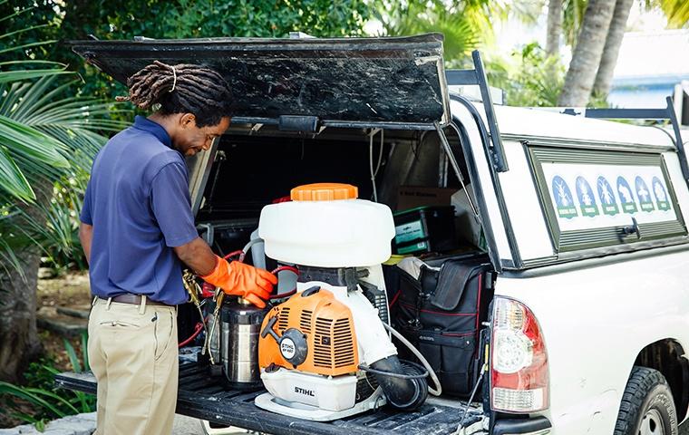 Technician treating for mosquitoes